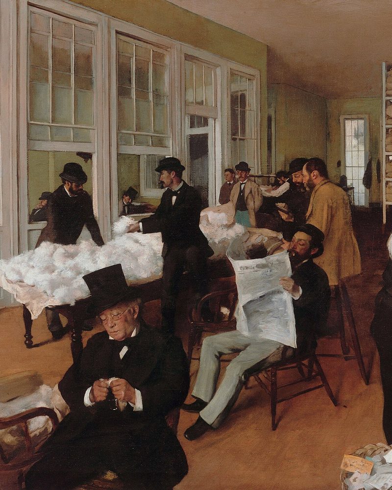 A busy office with a dozen people reading, sorting, and keeping the books